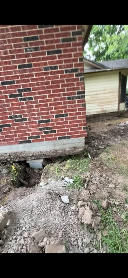 Foundation repair work under a Houston brick home